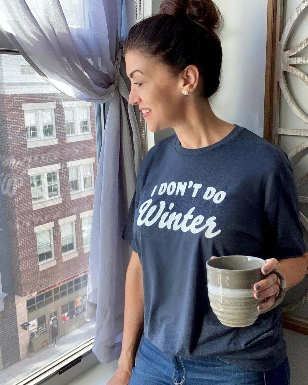 Woman in a black Texas sweatshirt